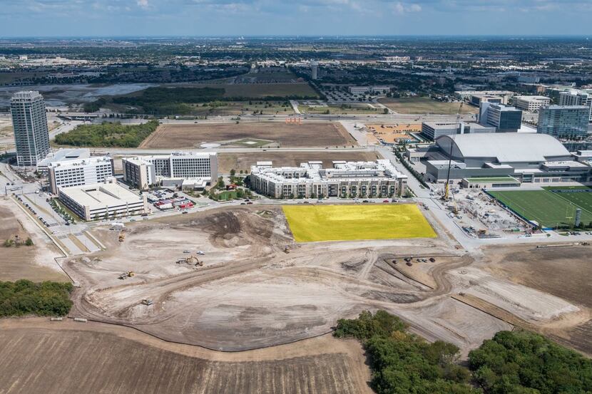 The new apartments are being built on a site (shown in yellow) next to the Dallas Cowboys'...