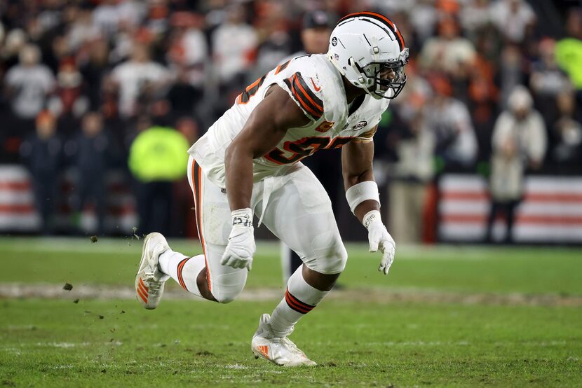 FILE - Cleveland Browns defensive end Myles Garrett (95) runs off of the line of scrimmage...