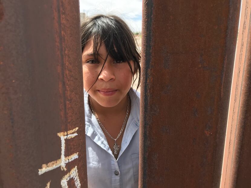 Michelle Aide Campos, 12, isn't happy with barriers that went up almost a year ago near her...