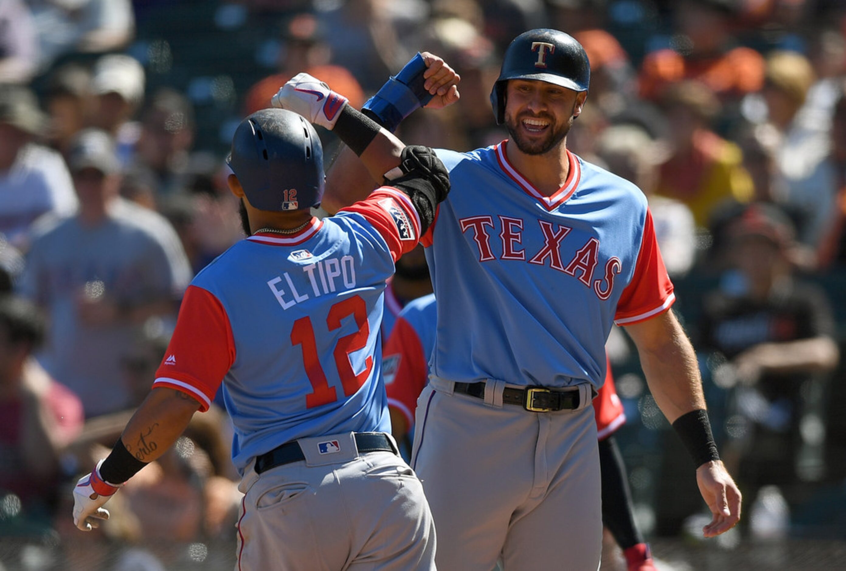 SAN FRANCISCO, CA - AUGUST 25:  Rougned Odor #12 and Joey Gallo #13 of the Texas Rangers...