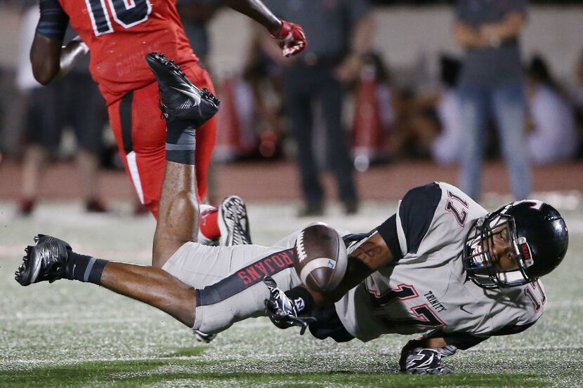 FILE - Euless Trinity defensive back Cam'ron Jones (17) almost intercepts the ball in the...