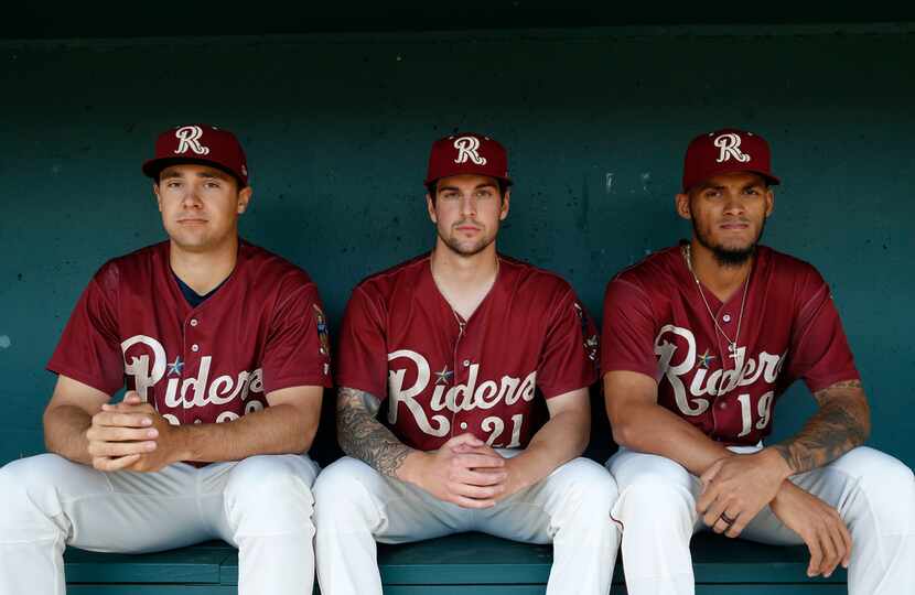 Frisco RoughRiders pitcher Brock Burke (23), Frisco RoughRiders pitcher Joe Palumbo (21) and...