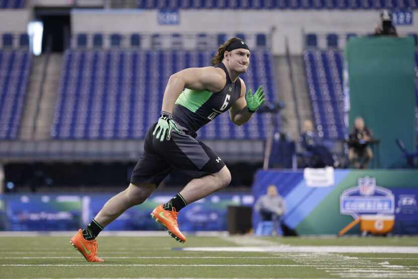 Ohio State defensive lineman Joey Bosa runs a drill at the NFL football scouting combine on...