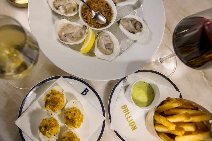 Our ideal order at Bullion's happy hour: oysters with Champagne mignonette, pommes frites...