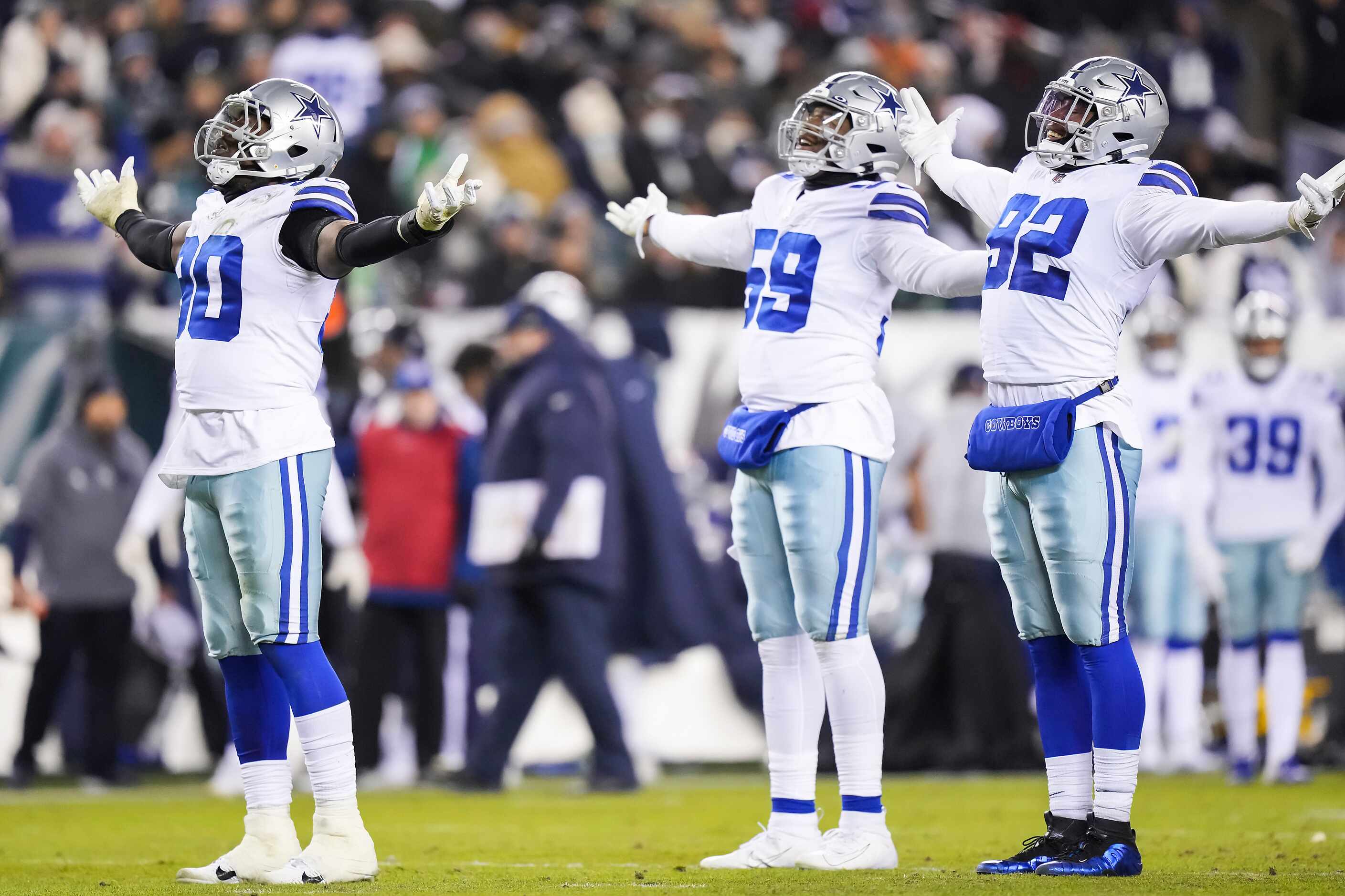 Dallas Cowboys defensive end Demarcus Lawrence (90) celebrates with  Dorance Armstrong (92)...