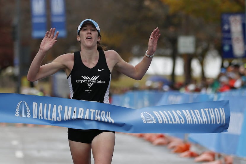 Jamie Vest reacts to winning the 45th running of the Dallas Marathon in downtown Dallas...