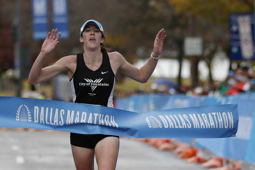 Jamie Vest reacts to winning the 45th running of the Dallas Marathon in downtown Dallas...