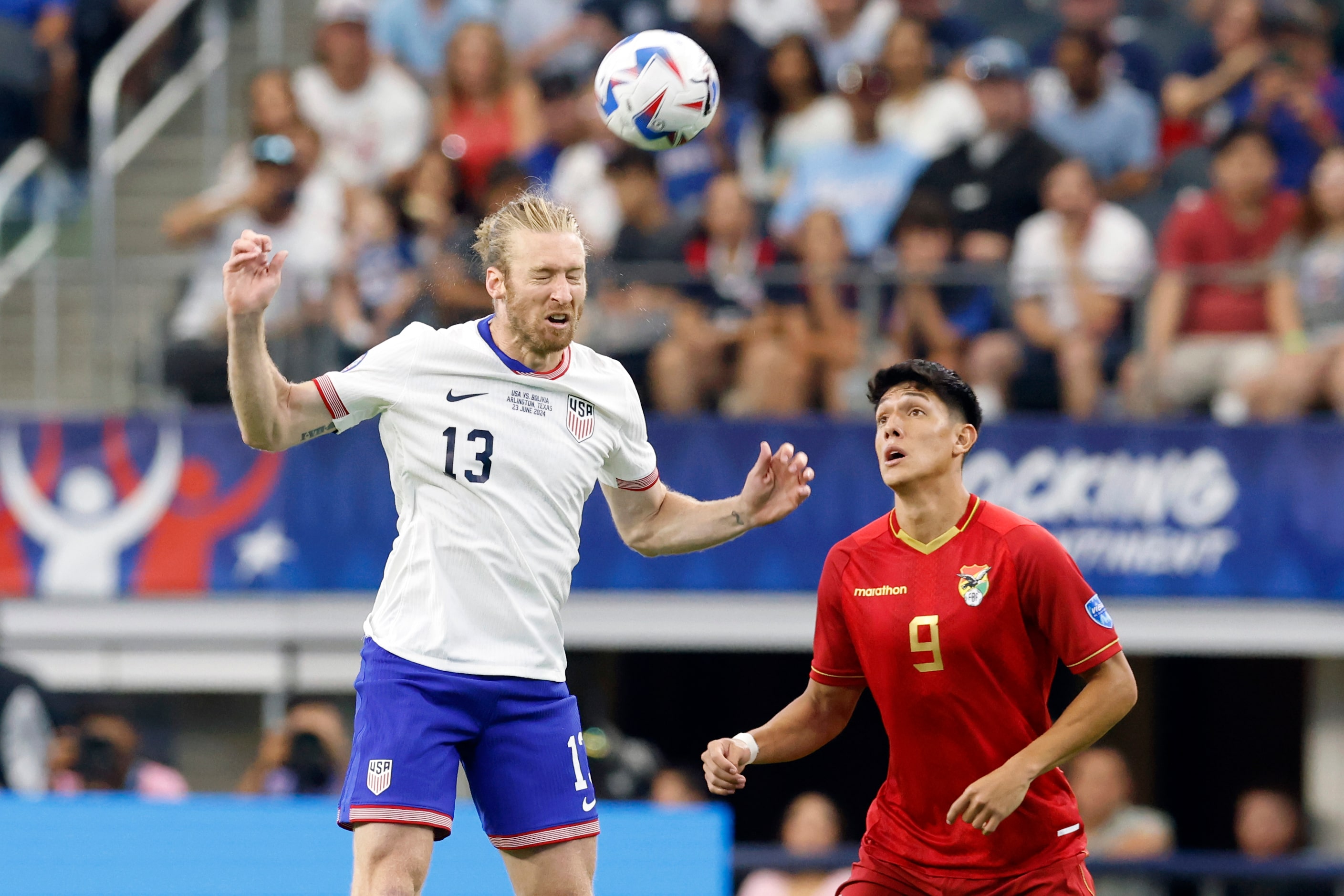 United States defender Tim Ream (13) heads the ball next to Bolivia forward César Menacho...