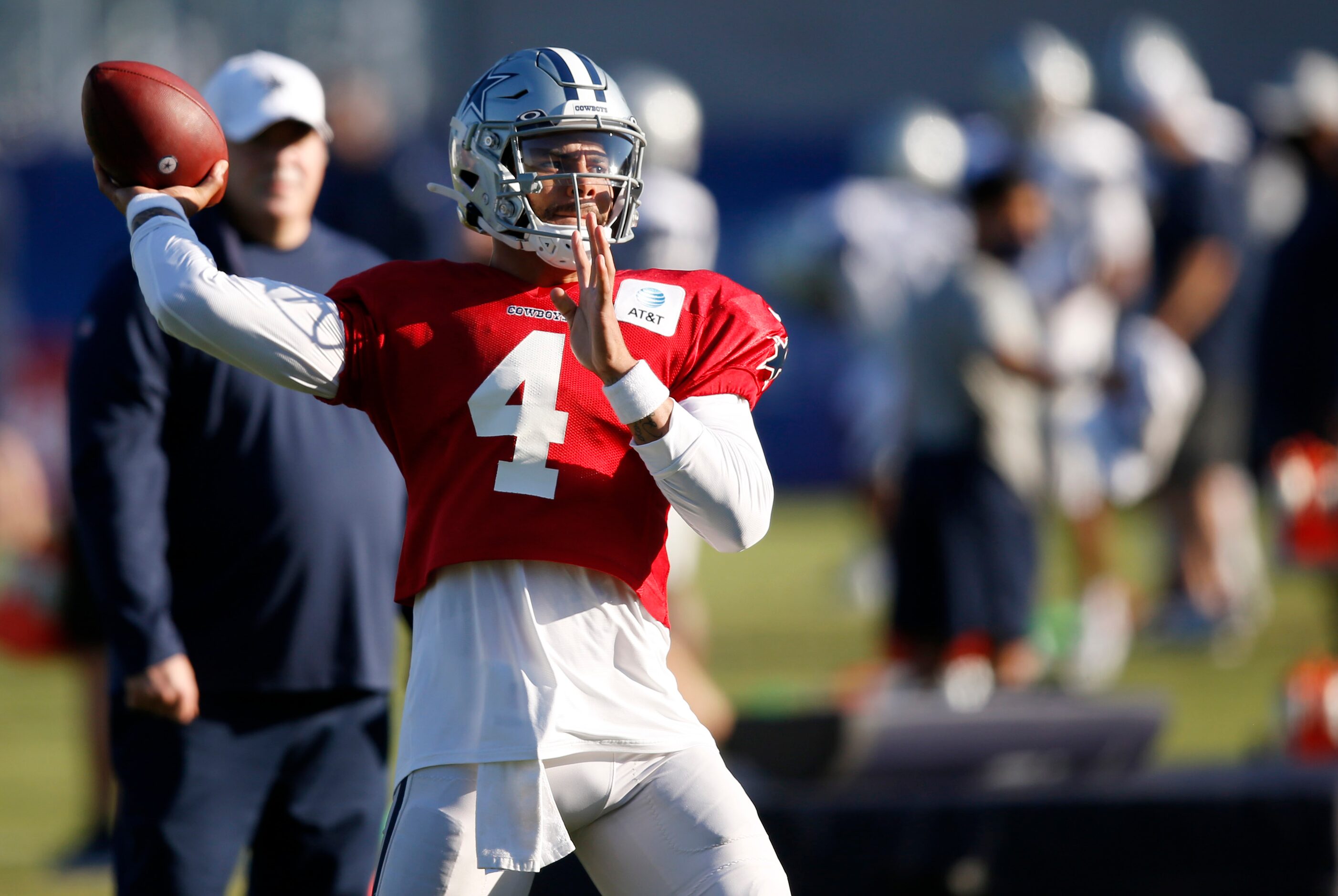 Dallas Cowboys quarterback Dak Prescott (4) throws the ball in a drill during training camp...