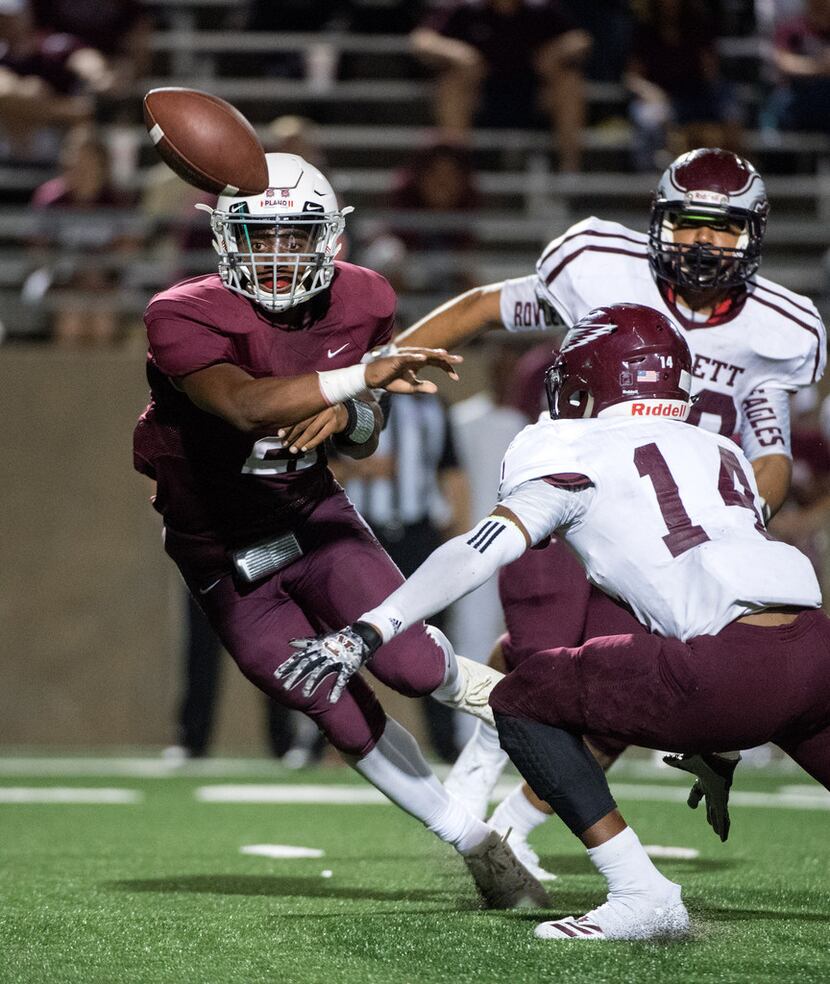 Plano senior quarterback Jonathan Taylor pitches the ball before being tackled by Rowlett...