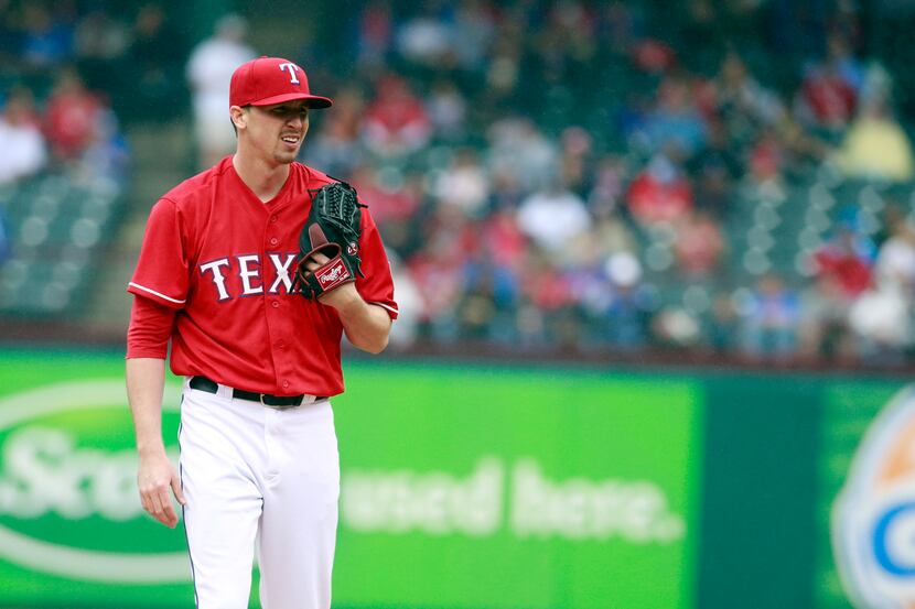Apr 17, 2014; Arlington, TX, USA; Texas Rangers starting pitcher Tanner Scheppers (52) on...