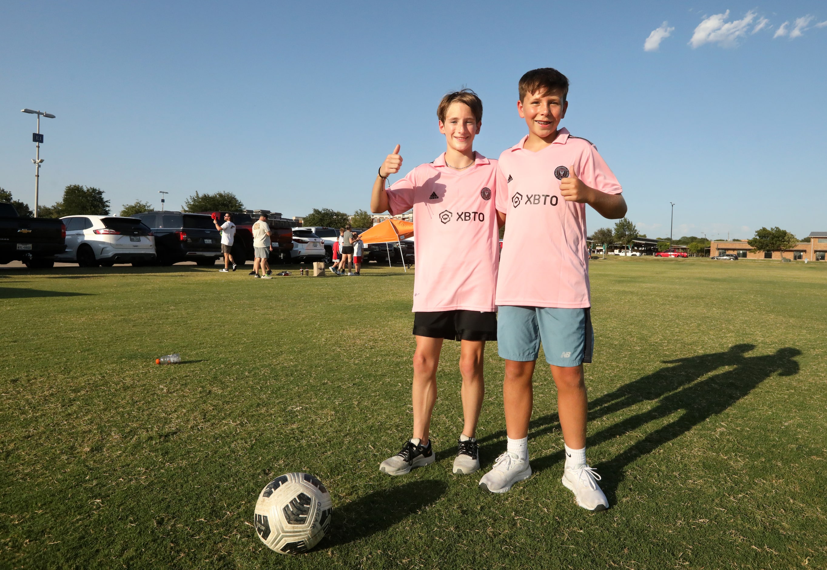 13-year-old Oscar Gooden, left, and 13-year-old Charlie Suchand pose for a photograph as...