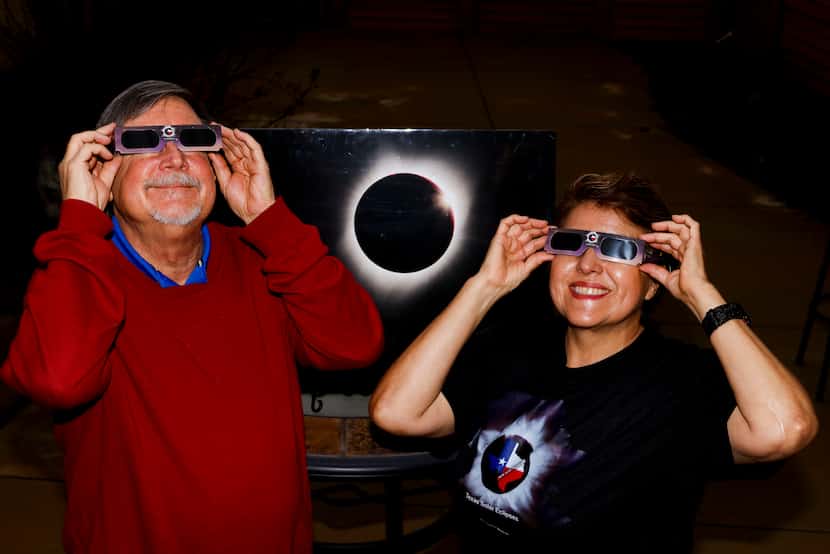 Solar eclipse enthusiast Leticia Ferrer and her husband, Daniel Brookshier, pose for a photo...