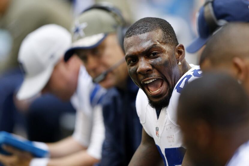 Dallas Cowboys wide receiver Dez Bryant (88) attempts to keep the spirits up on the bench...