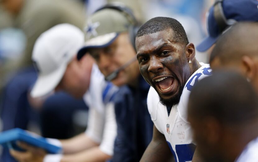 Dallas Cowboys wide receiver Dez Bryant (88) attempts to keep the spirits up on the bench...