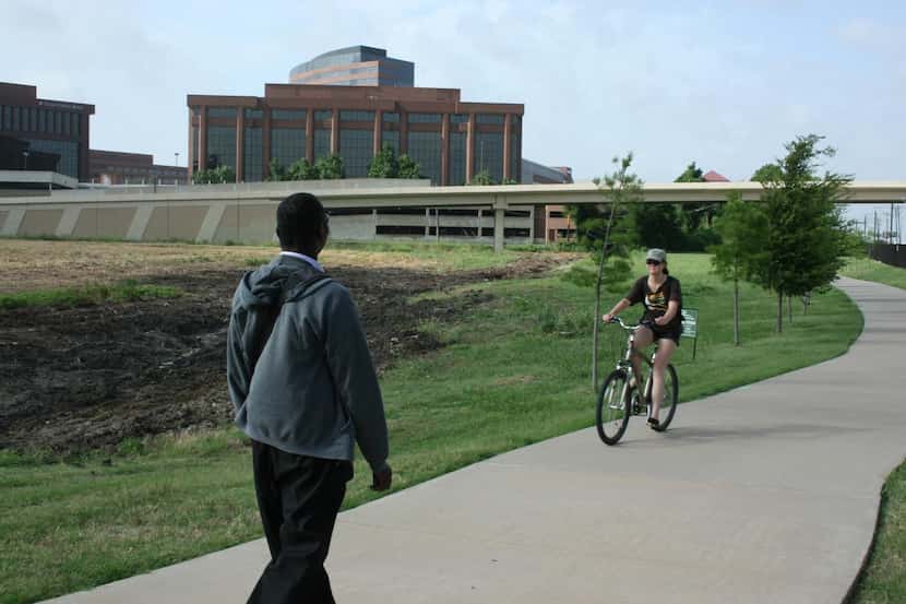 
Richardson residents use the city’s Central Trail near the offices of BlueCross BlueShield...