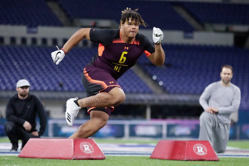 UCF defensive lineman Trysten Hill runs a drill at the NFL football scouting combine in...