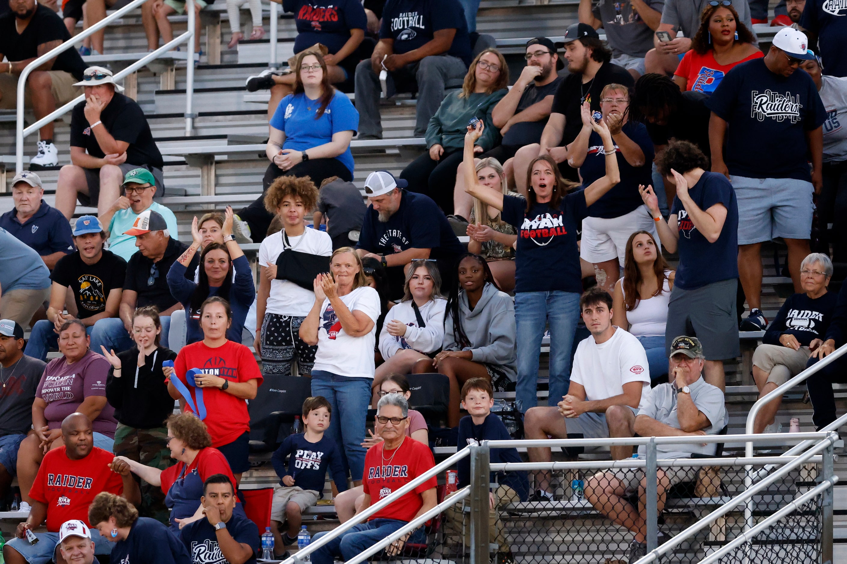 Denton Ryan fans cheer after an interception during the first half of a District 3-5A game...