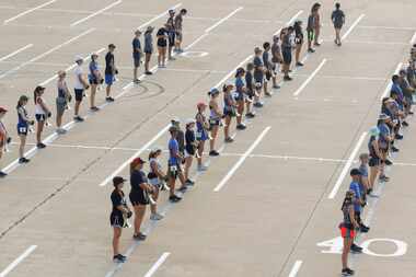 Members of the Keller High School Indian Band  line up during practice Wednesday morning...