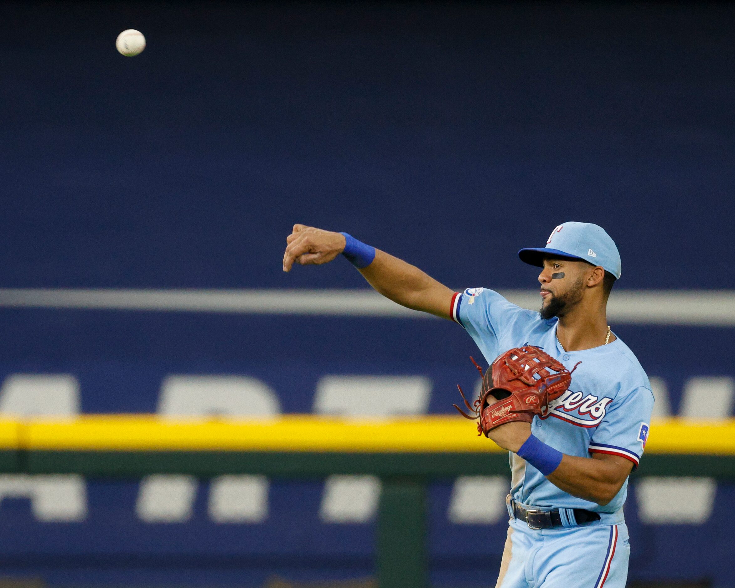 Texas Rangers center fielder Leody Taveras (3) fields the ball after a hit during the...