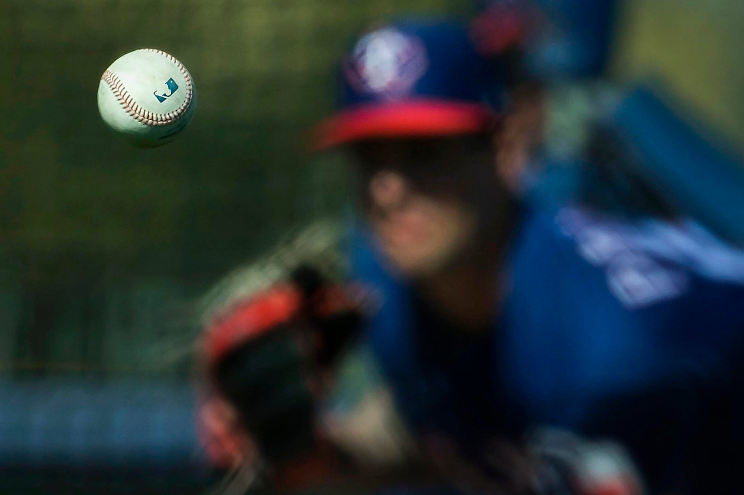 Texas Rangers pitcher Joe Palumbo throws live batting practice during a spring training...