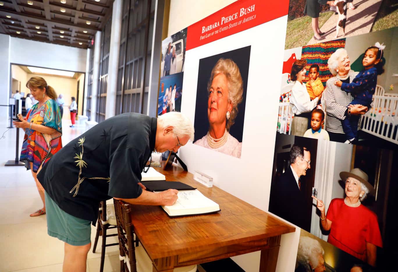 Bob Wilson of Sugar Land signed a memory book for former first lady Barbara Bush on...
