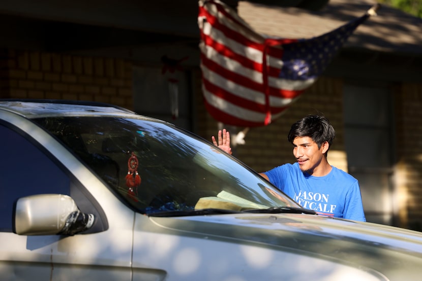 Nicolas Quintanilla talks to residents as he campaigns for Jason Metcalf for Dallas County...