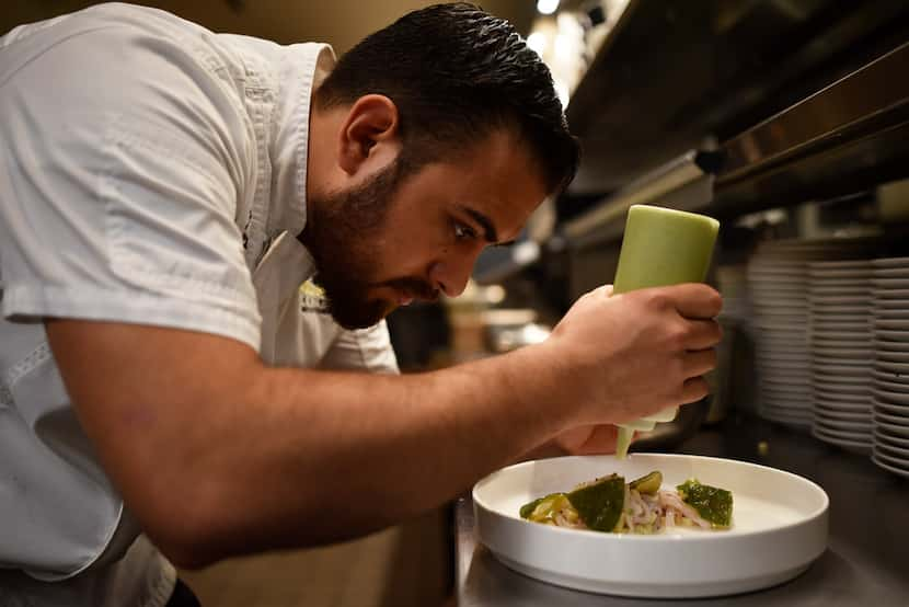 Executive chef José Meza prepares a dish of Black Habanero Ash Ceviche with Hoja Santa...