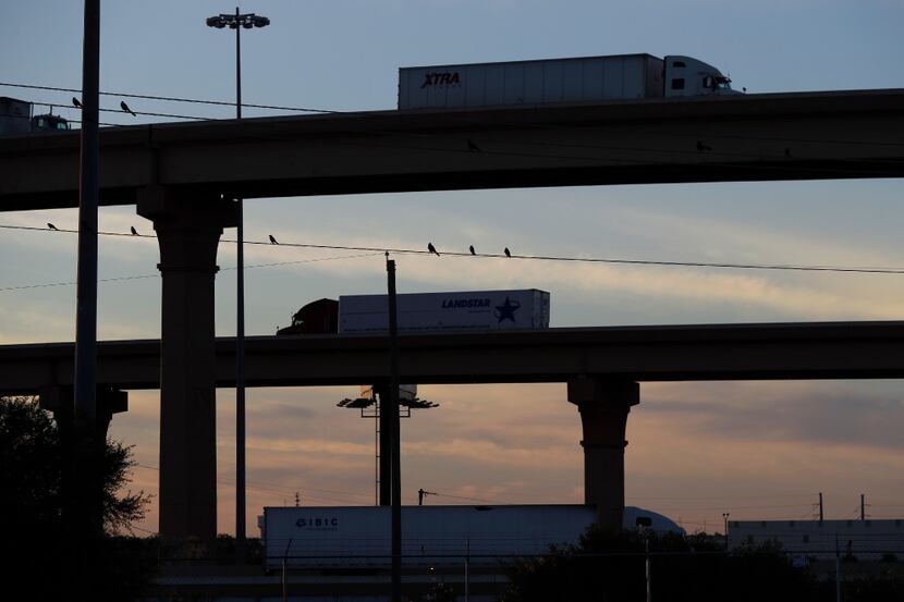 Trucks travel on an overpass to and from the World Trade Bridge, in Laredo, Texas. Donald...