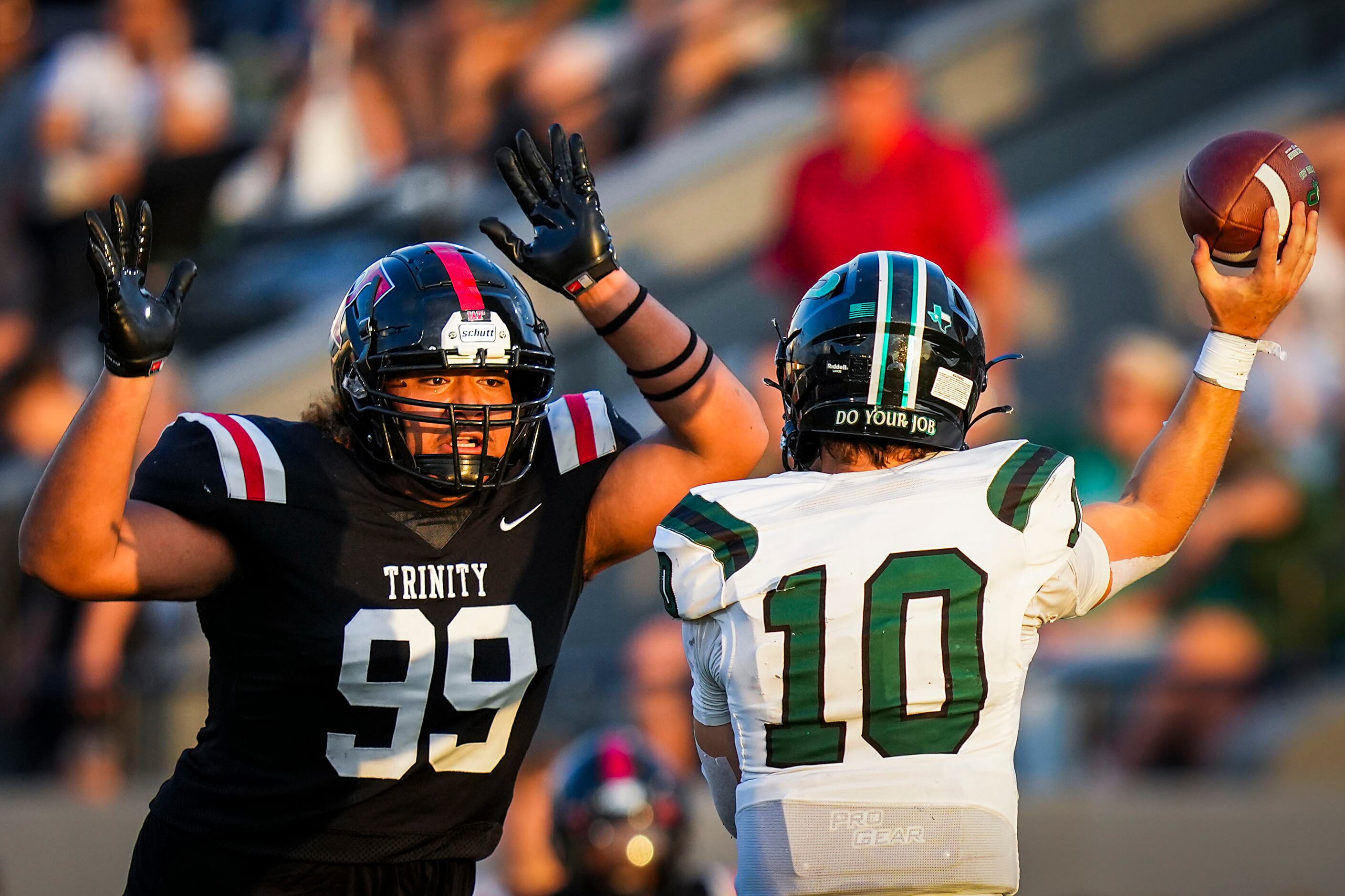 Prosper quarterback  Harrison Rosar gets off a pass under pressure from Euless Trinity...