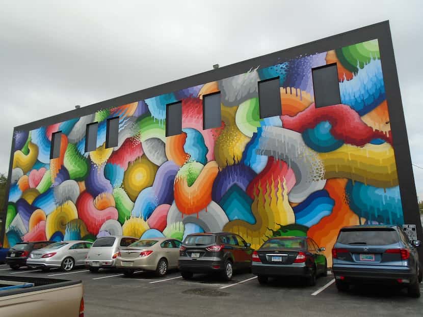 Ricky Watts used 500 cans of spray paint to hand-paint Space Rainbows, a giant mural in...