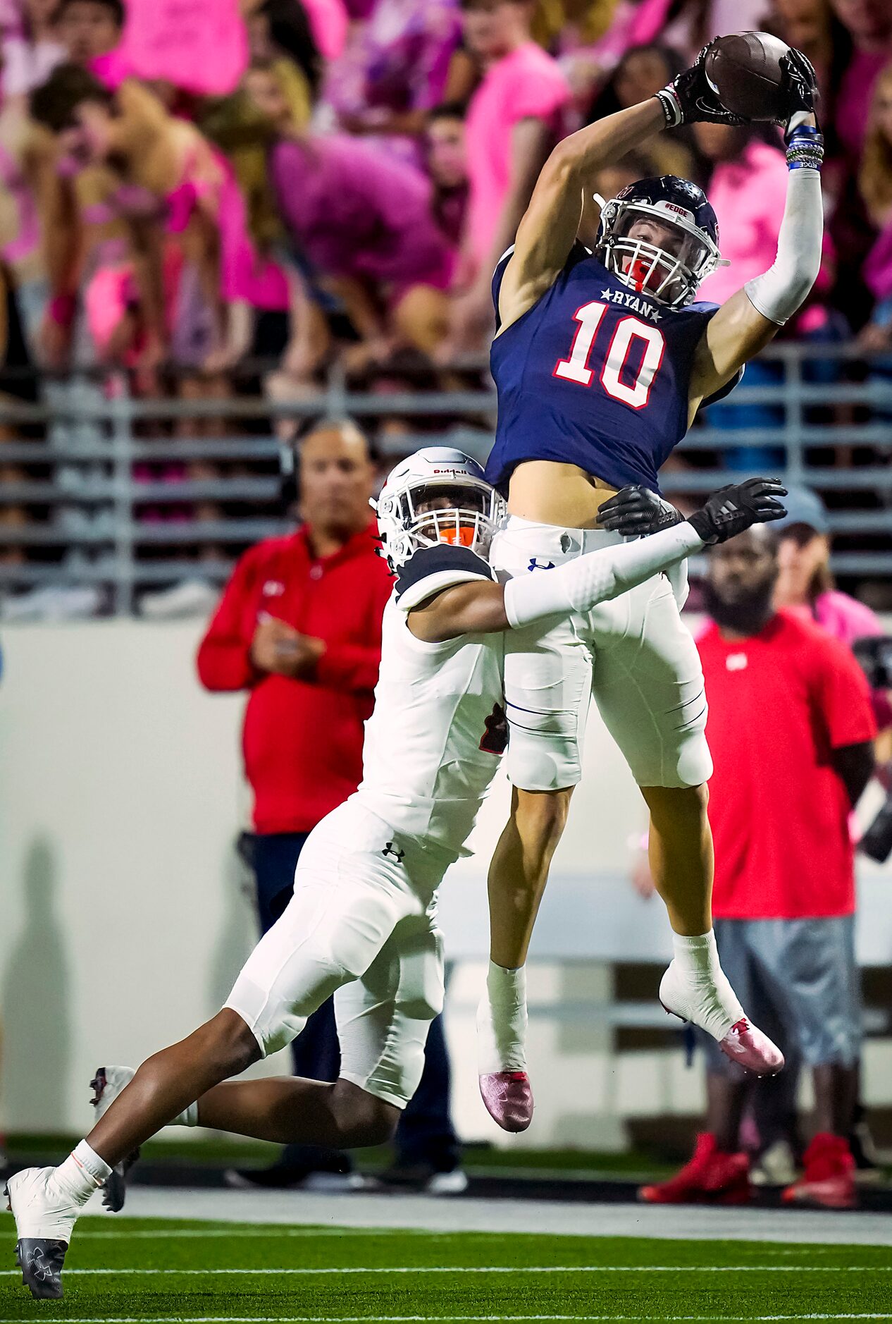 Denton Ryan’s Braeden Mussett (10) makes a leaping catch as Aledo defensive back Jaden Allen...