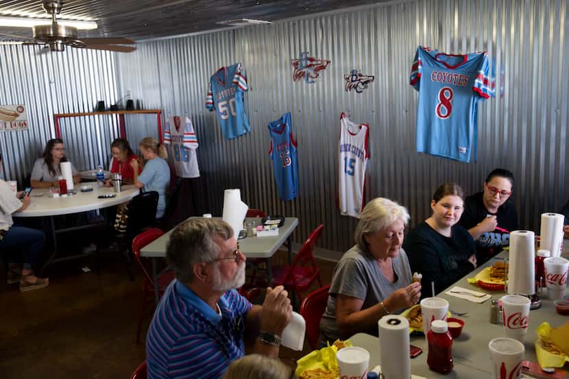 Borden County High School football jerseys hang in the background at The Blue Paw Cafe as...