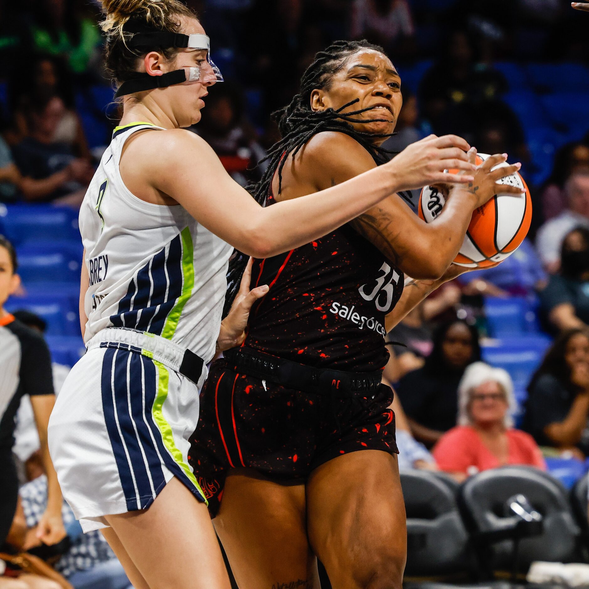 Indiana Fever guard Victoria Vivians (35) tries to protect the ball from Dallas Wings guard...