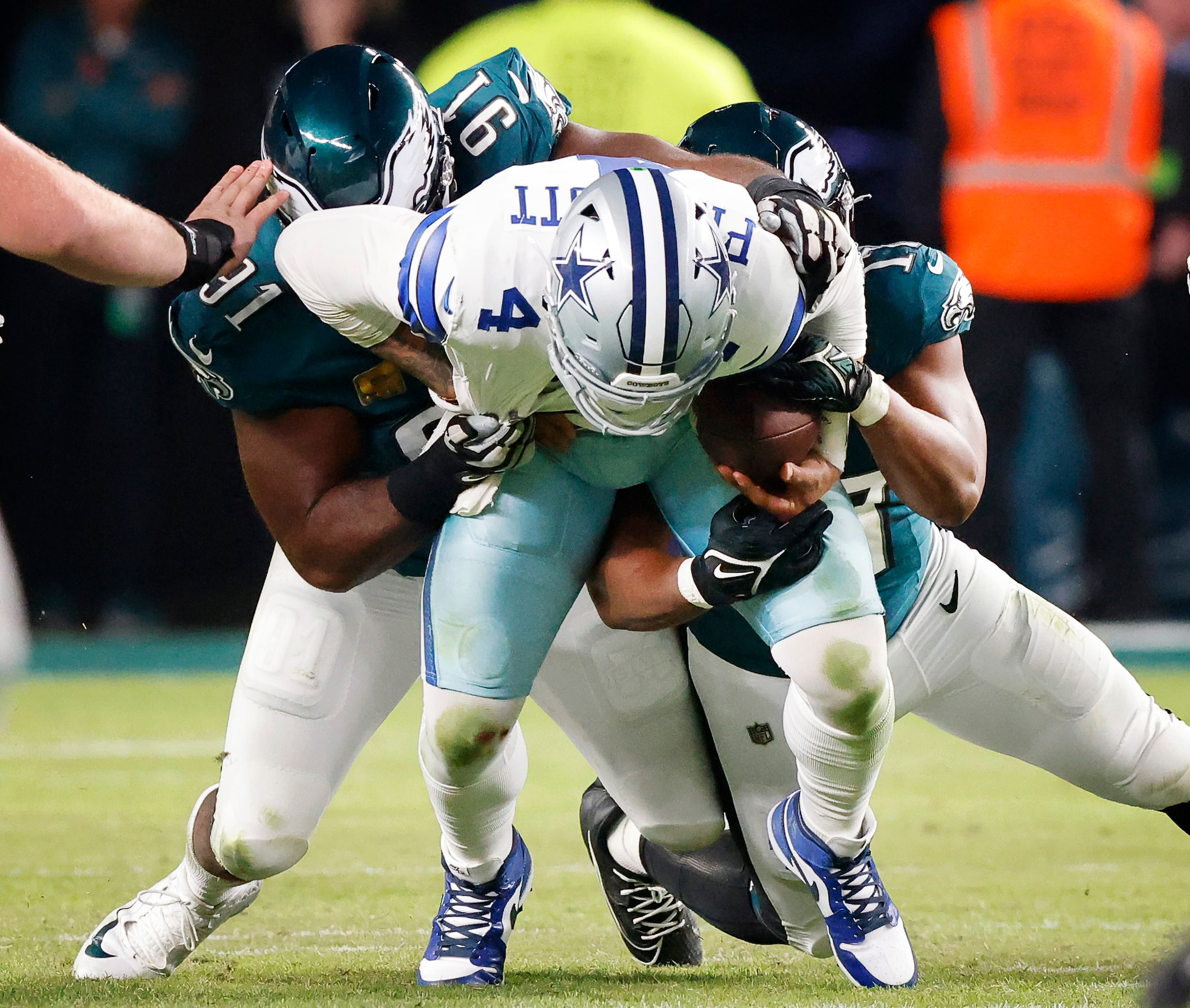 Dallas Cowboys quarterback Dak Prescott (4) is sacked by Philadelphia Eagles defensive...