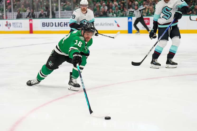 Dallas Stars center Max Domi (18) reaches for the puck during the first period in Game 5 of...