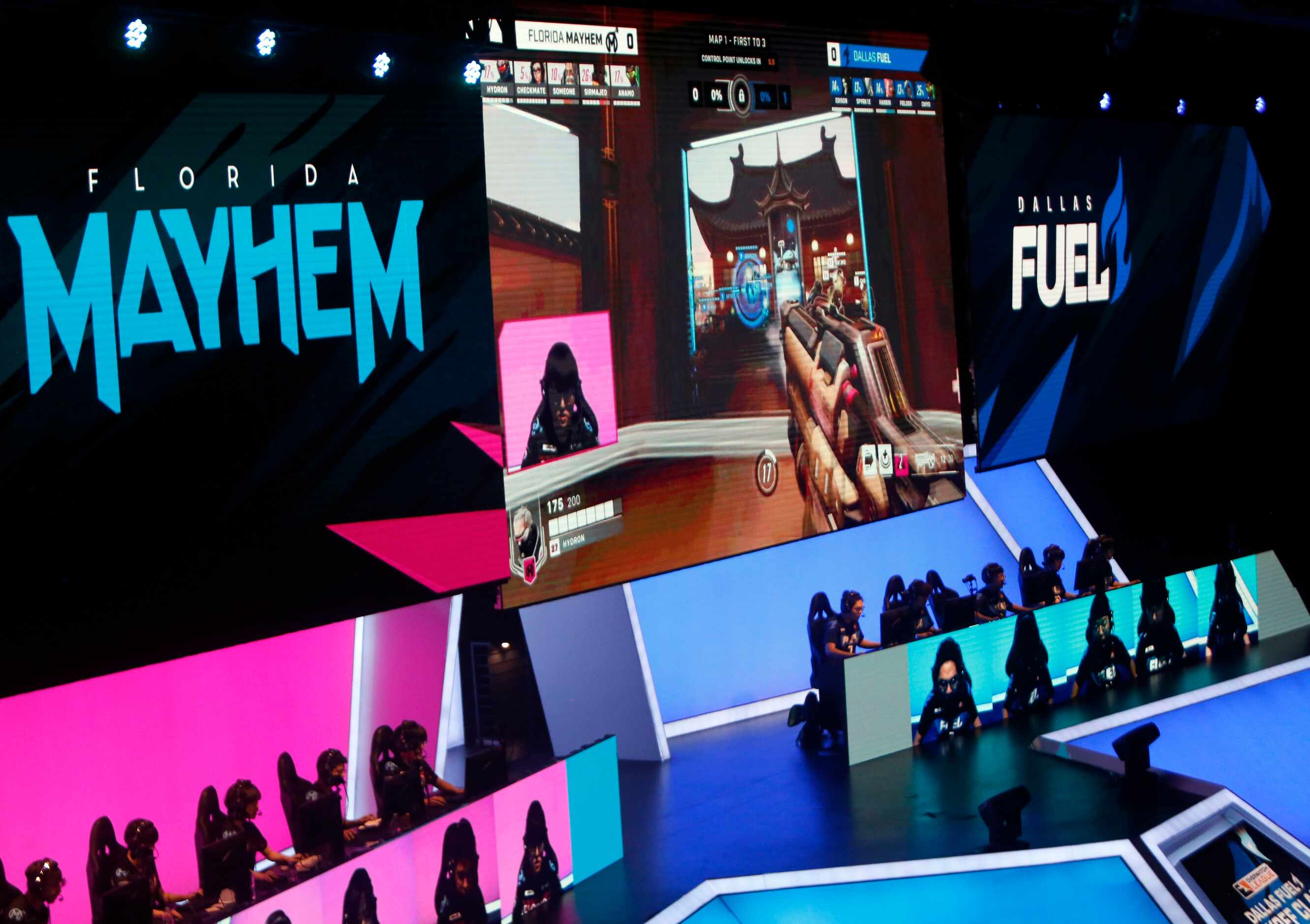 Florida Mayhem, left, battle against Dallas Fuel during the first mat of competition. The...