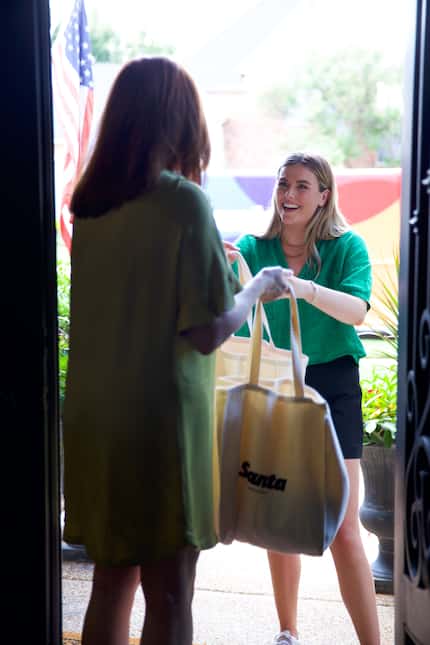 Santa employee Mallory Higginbotham drops off an order to a customer in Plano.