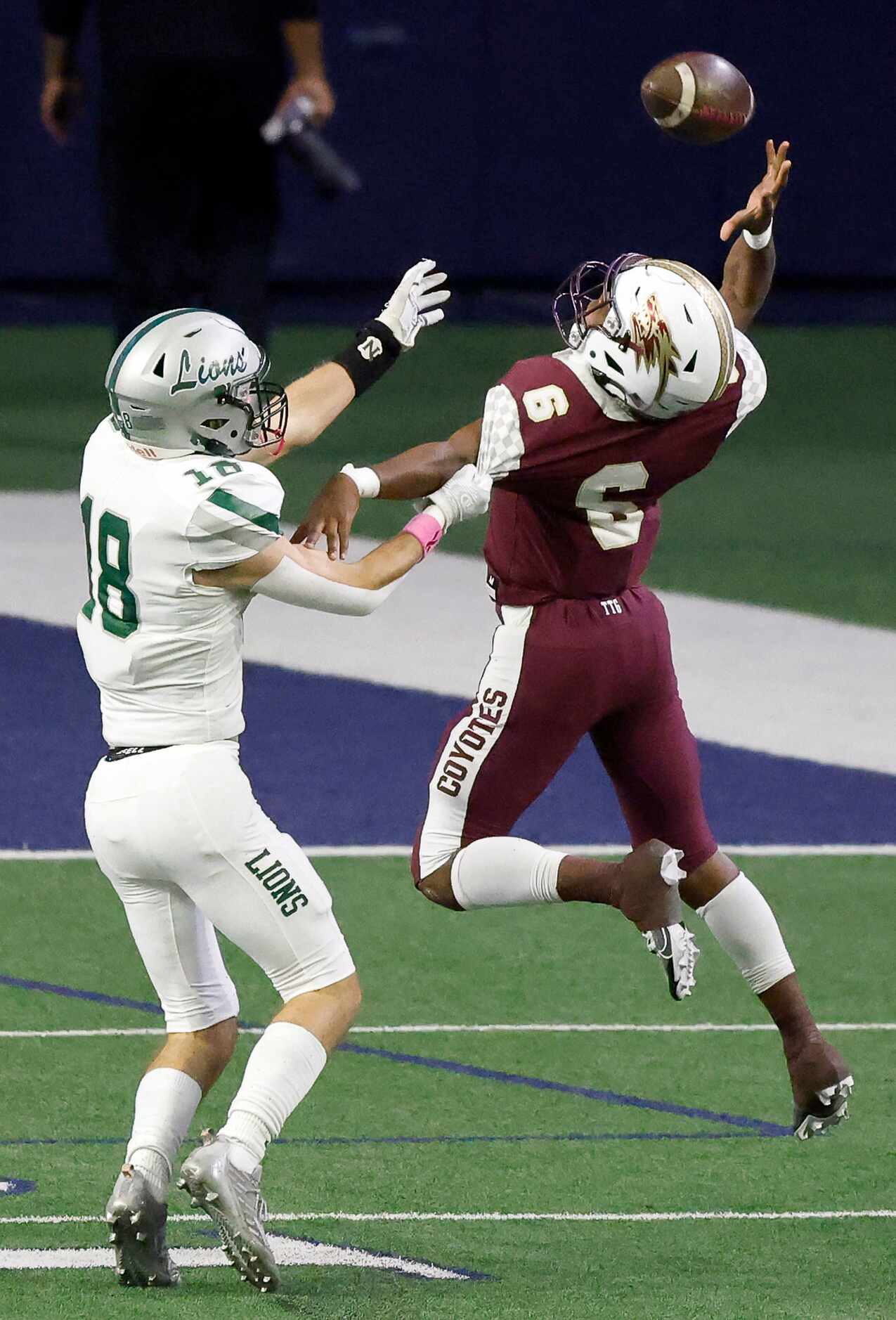 Frisco Reedy defensive back Cole Powell (18) holds  Frisco Heritage receiver Nick Clark (6)...