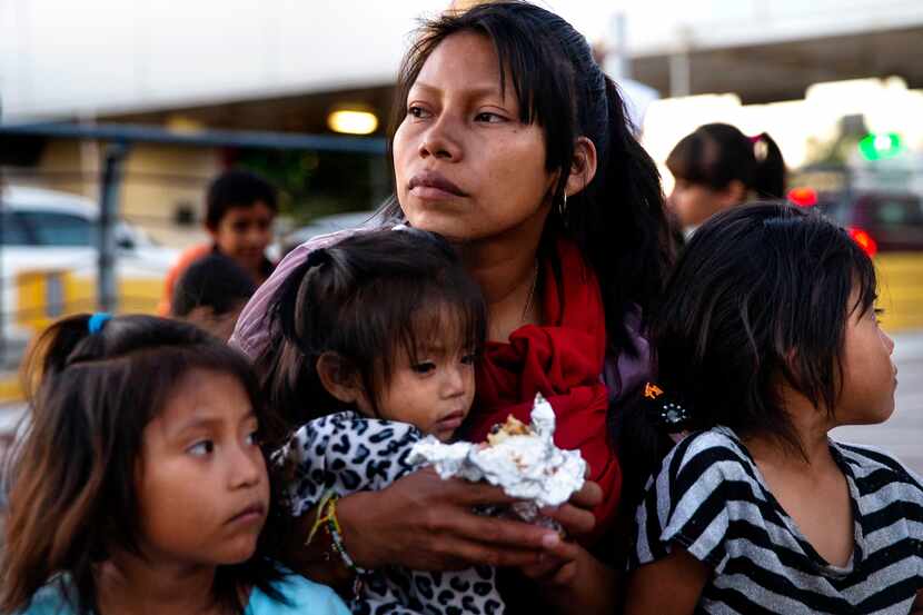 Patricia Giron held daughters Yesenia (left), 6; Wendy (center), 1; and Yocelyn, 6, at the...