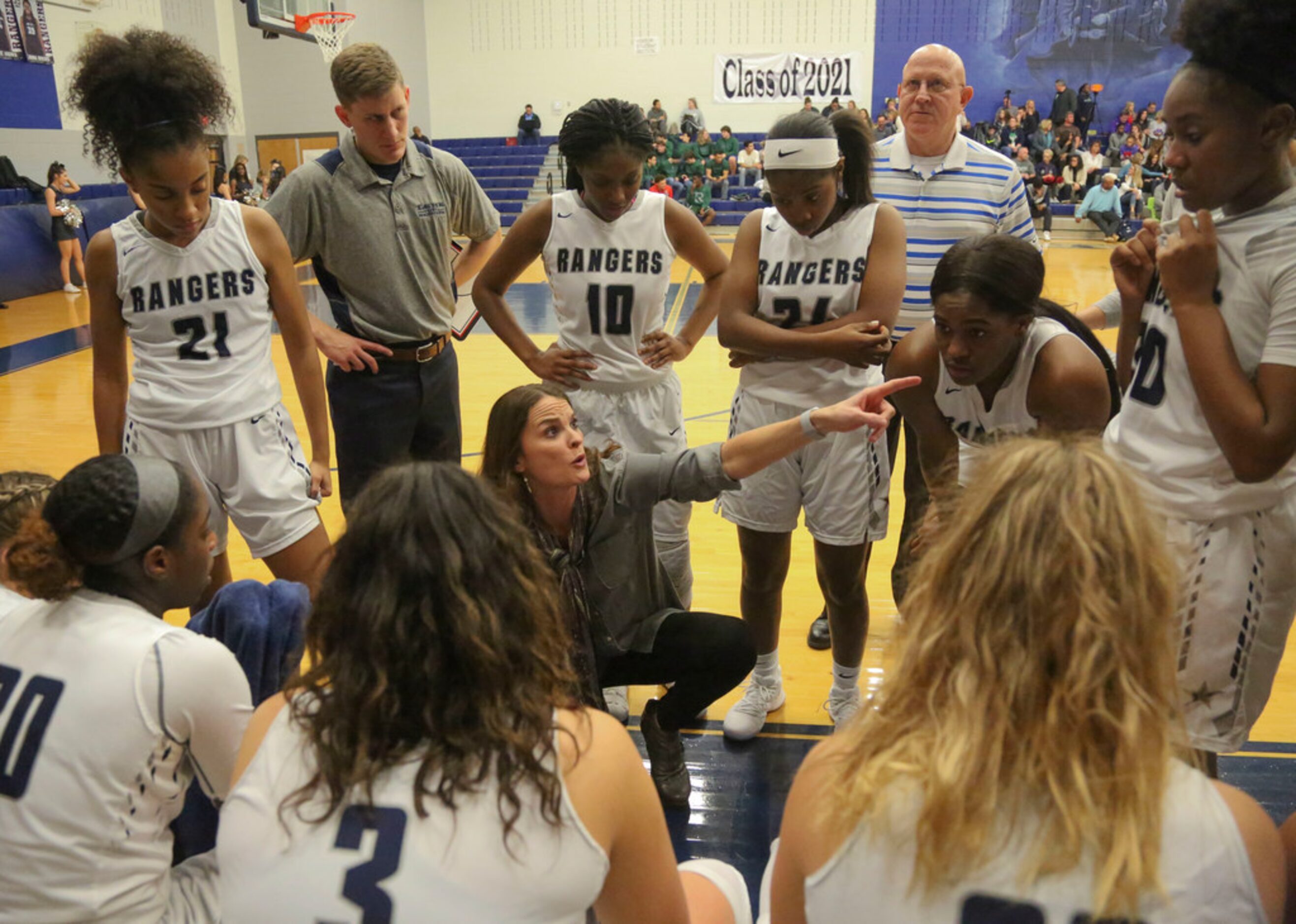 Frisco Lone Star  head coach Katie Stinton talks to her team during a time out against...