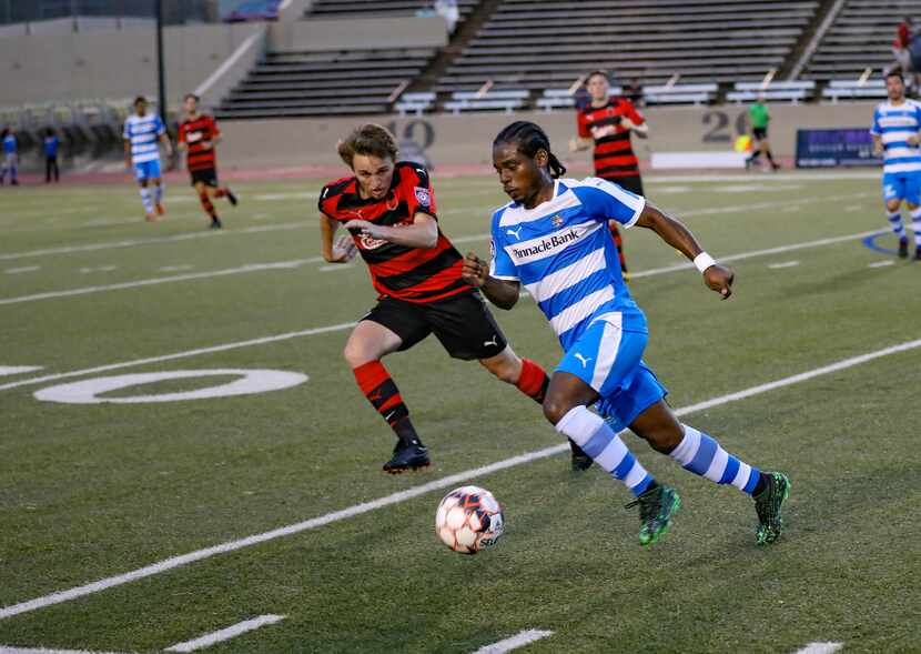 Darren Mitchell of the Fort Worth Vaqueros dribbles past a Denton Diablos defender in the...