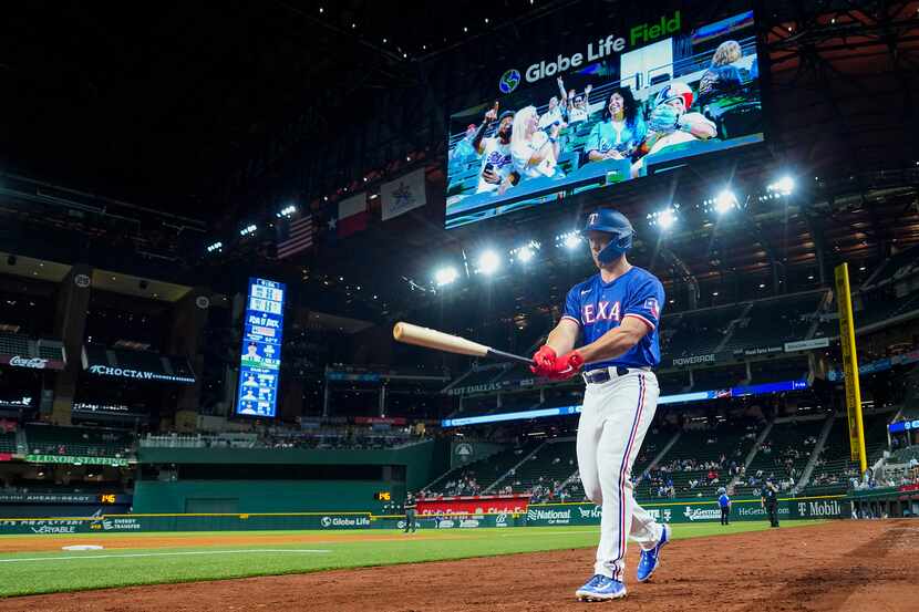 Texas Rangers designated hitter Wyatt Langford heads to the plate during the ninth inning of...