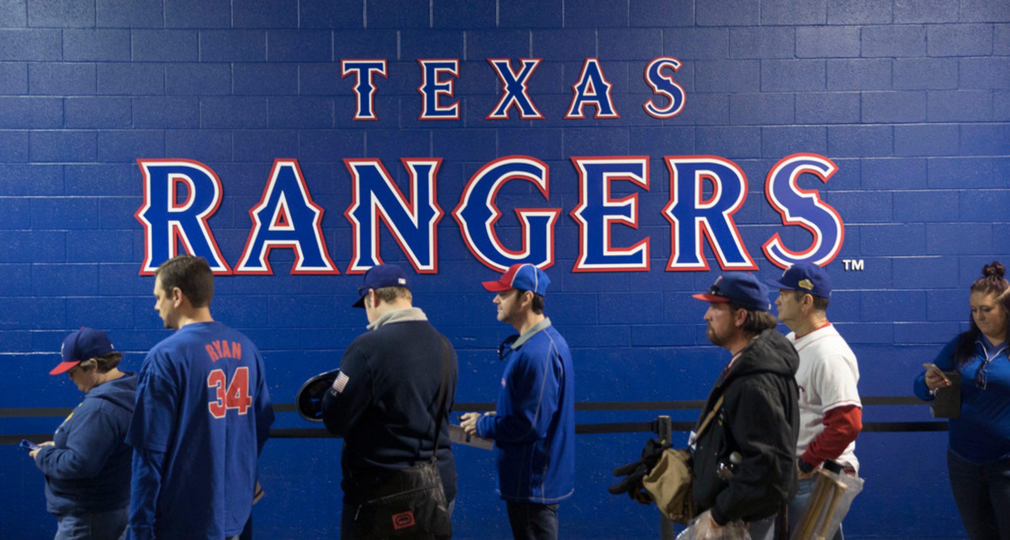 Fans line up to enter the Foundation Sale, where they can purchase merchandise, during Texas...