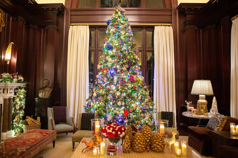 Designer Kelli Ford's living room features a  15-foot faux Balsam Hill tree adorned with her...