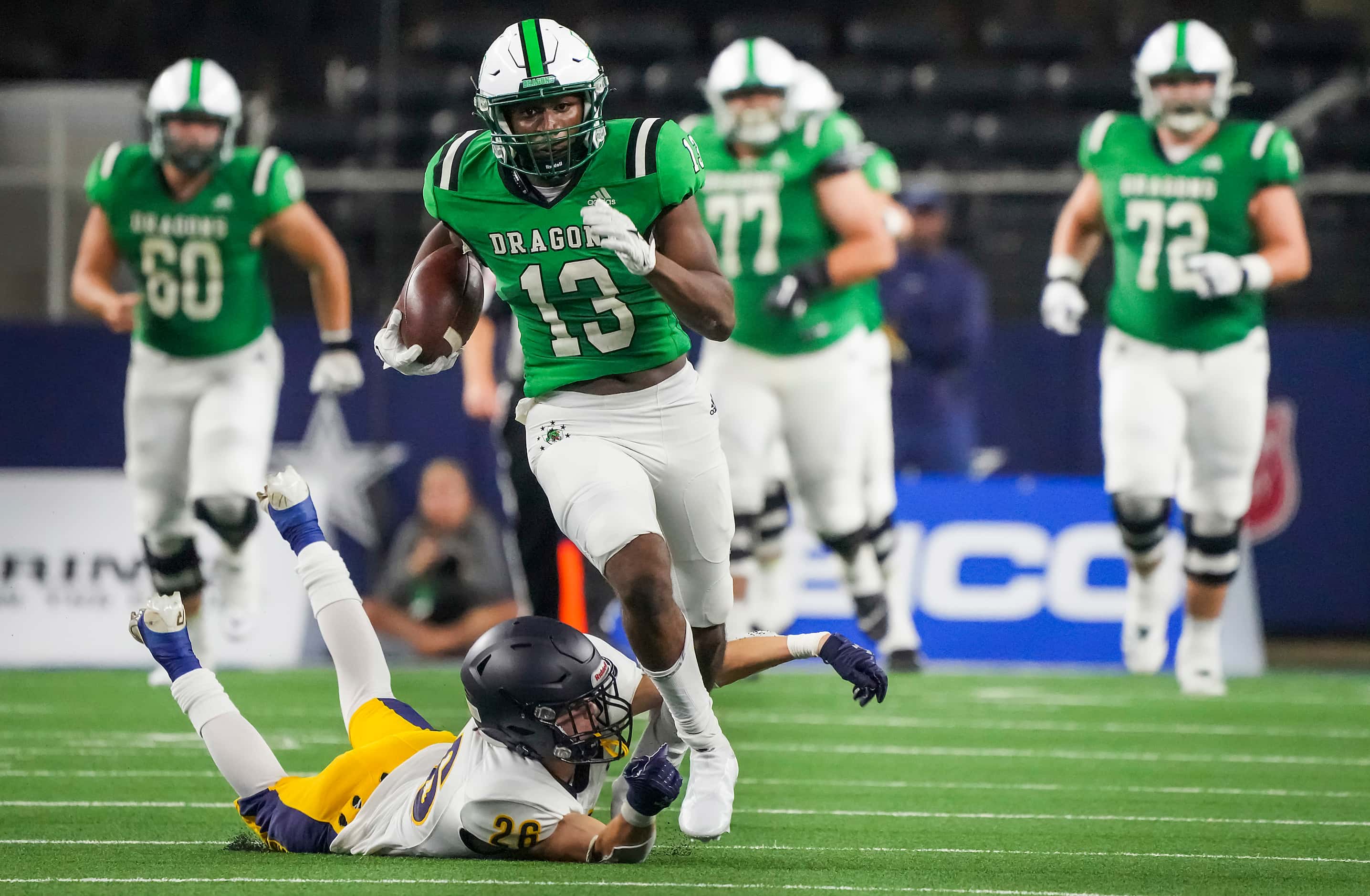 Southlake Carroll wide receiver RJ Maryland (13) is tripped up by Highland Park defensive...