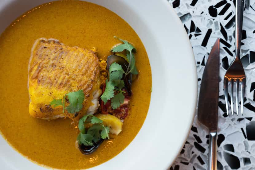 The skate moqueca is made with charred plantain and coconut broth, dende oil and steamed rice.