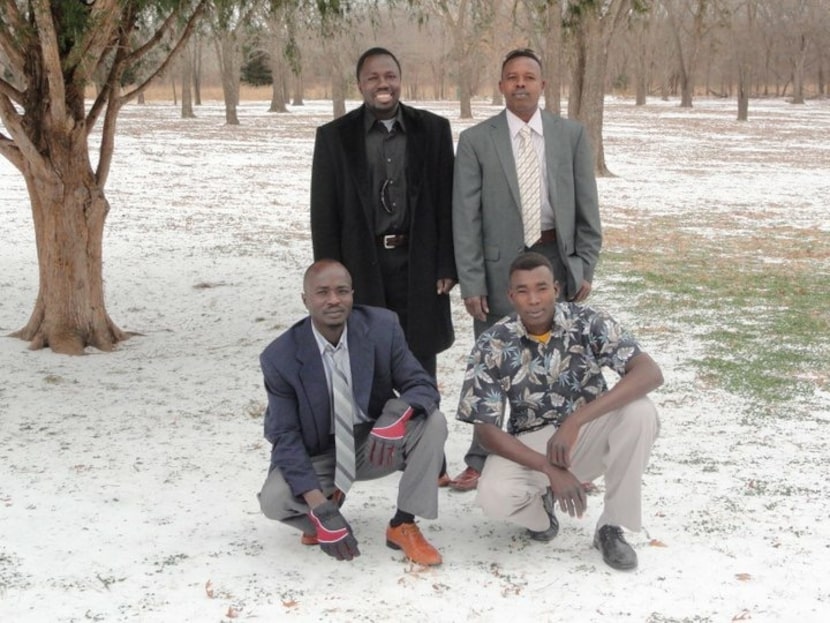 Mohammed Adam (left, kneeling) and Mohammed Ibrahim (left, standing) enjoyed a snow day in...