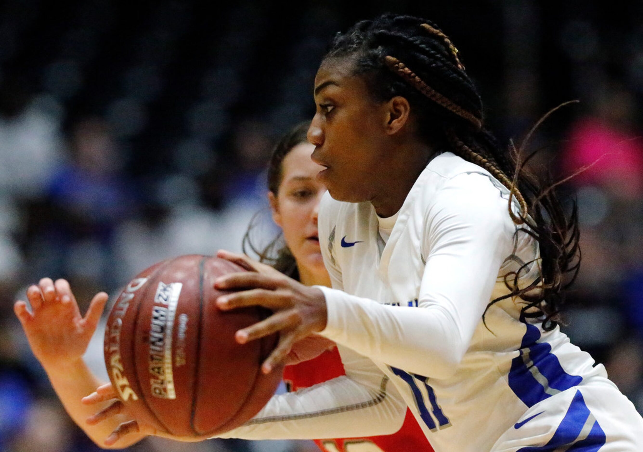 Midlothian High School guard Maykayla Jackson (11) drives toward the basket during the...