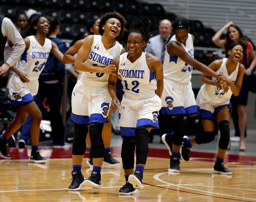 Mansfield Summit players Jaicia Canady (10) and Tamera Derrough (12) dance together at...